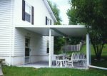 patio covers over a concrete pad with a center support