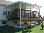 Patio Cover on a deck with brown railing